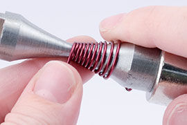 Continuing wrapping the wire around the mandrel
